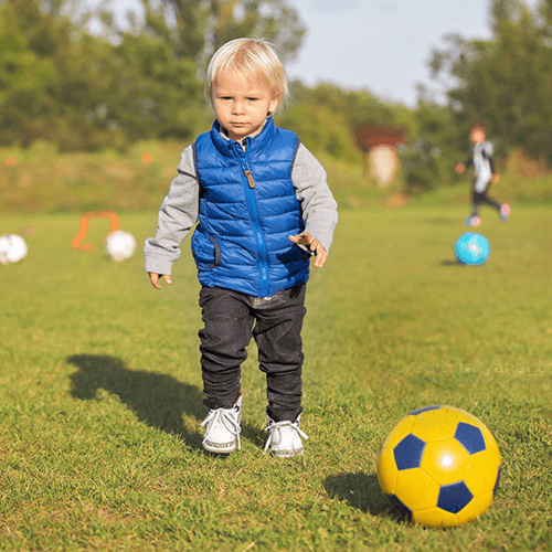 toddler playing soccer