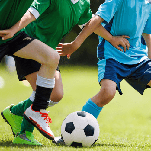Kids playing soccer with Teton FC